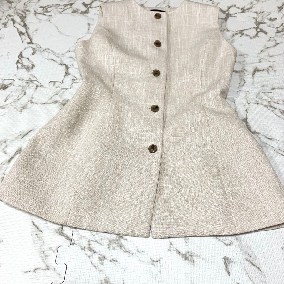 【美品】anuans フロントボタンぺプラムブラウス ベージュ